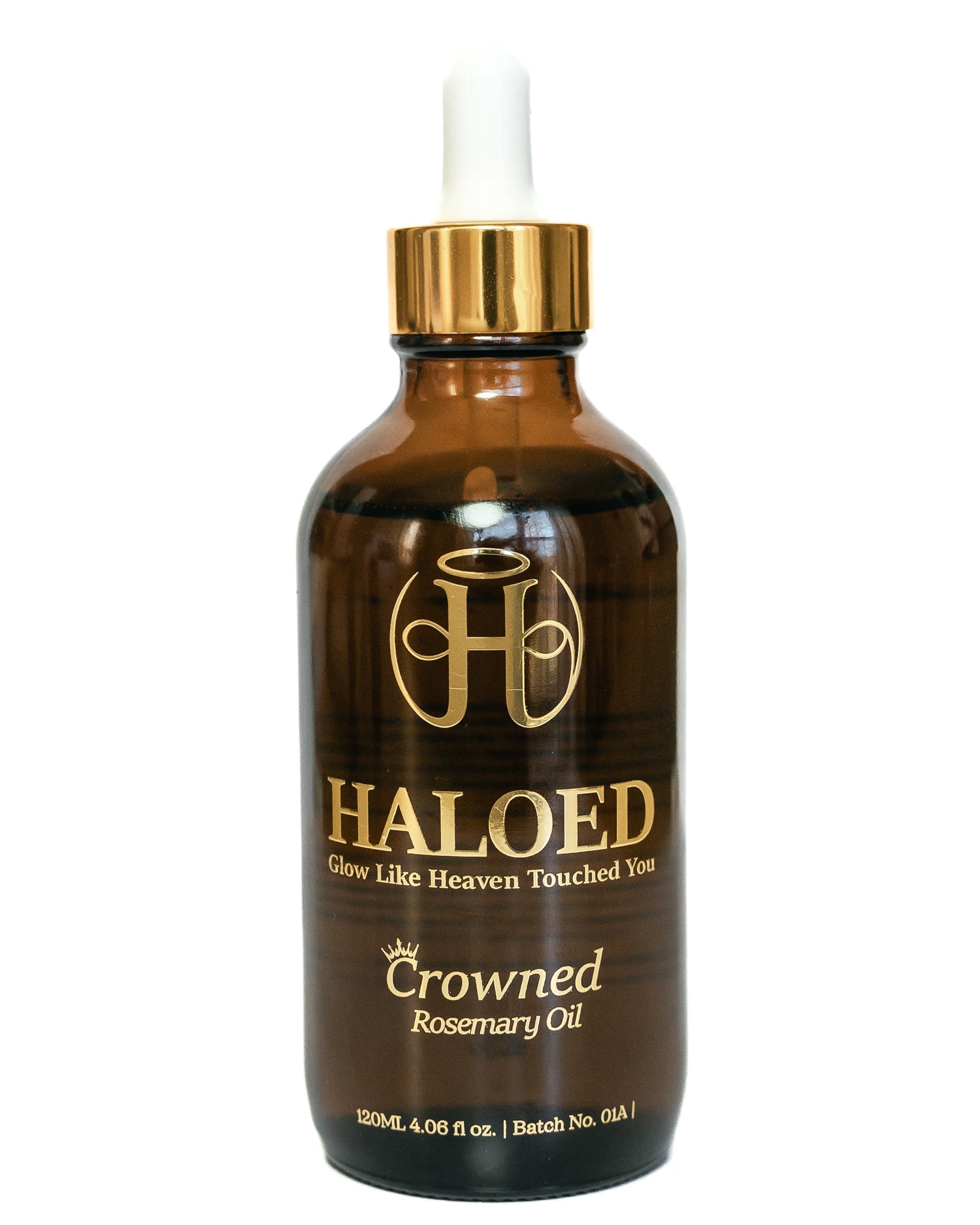 Brown bottle of Haloed Crowned Rosemary Oil with gold cap on a white background