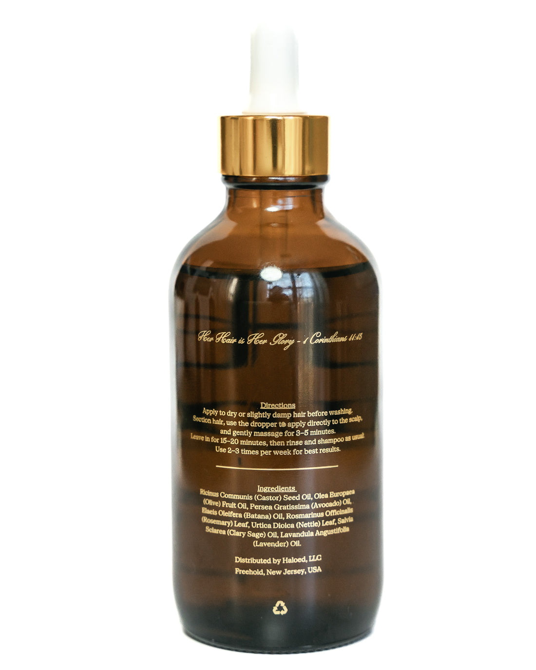 Brown glass bottle with gold cap on a white background